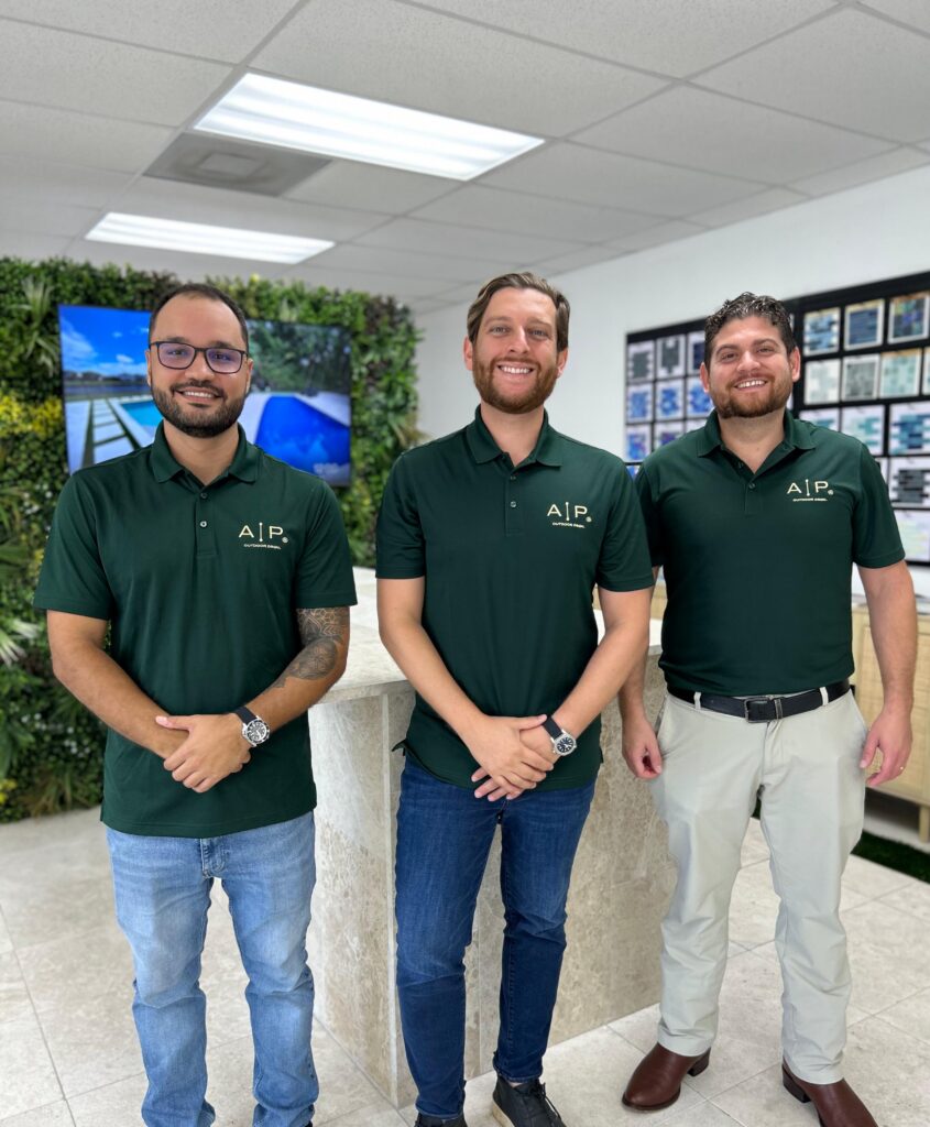 Team photo of AP Outdoor Design professionals smiling and standing together outdoors